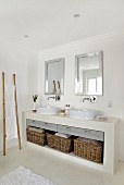 Masonry washstand with countertop sinks and storage baskets in base