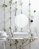 White bathroom with flowers and leaves on wall