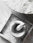 Mortar and pestle, dish and table top made from white marble