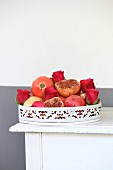 Pomegranates and roses on vintage tray