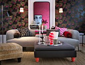 Upholstered furniture, dark floral wallpaper and portrait of woman in living room