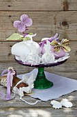 Card gift boxes and paper butterflies on cake stand