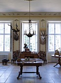 Interior decorated with African hunting trophies in stately home