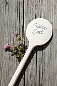 Ornamental oregano and wooden spoon used as plant label
