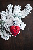 Christmas arrangement of red love-heart and snowy branches