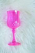 Pink crystal glass on sheepskin