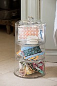 Buttons and ribbons in vintage-style stacking glass jars