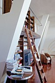 Two-storey bookcase with wooden ladder