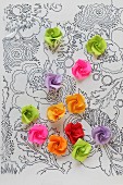 Paper roses on transparency with hand-drawn floral pattern