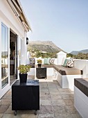 Summery terrace with Mediterranean ambiance and view of mountains