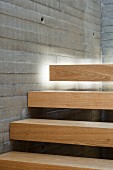 Indirect lighting emphasising floating effect of wooden stair treads