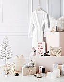 Feminine Christmas gift ideas in front of white wall