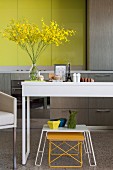 Ornaments on table in modern kitchen with yellow accents