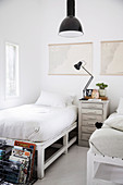 Guest room with two pallet beds with bedside tables in between