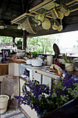 Outdoor kitchen with roof and rustic decorations