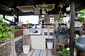 Outdoor kitchen with roof and rustic decorations