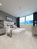 Pale carpet and double bed in elegant bedroom