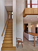 Schmaler Treppenaufgang neben eleganter, offener Küche, darüber Galerie