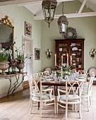 Festively set table in dining room in natural shades