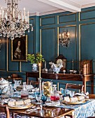 Antique furniture in classic dining room with panelled walls