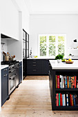 Bookshelves in the kitchen island in gray and white kitchen
