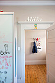 Children's room with name lettering, wardrobe in the hallway