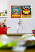Retro posters on kitchen wall