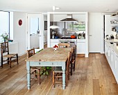 Wooden table and various chairs in modern kitchen