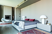Designer furniture in elegant bedroom in shades of grey