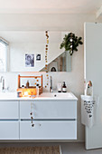 Simple Christmas decorations in white modern bathroom