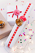 Wrapped gifts with flowers from muffin cuffs