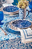 Table set in mixture of blue and white patterns