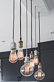 Various pendant lamps with light bulbs of different shapes