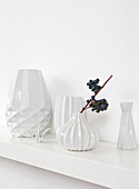 White structured vases on shelf