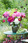Early summer bouquet on table in the garden