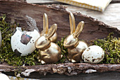 Unusual Easter table decoration with golden easter bunnies