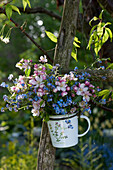 Small bouquet made of malus (apple) branches and myosotis