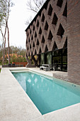 Terrace and swimming pool outside modern architect-designed house