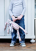 Boy holding cloth rabbit