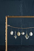 Old Christmas decorations in gilt picture frame