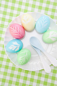 Pastel Easter eggs with leaf motifs