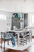 Dining room in shades of grey with blue accents