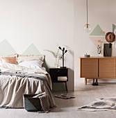 Pastel colored bedroom with triangles on the walls