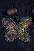 Clay butterfly embossed with lace pattern and painted