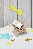 Baby in manger handmade from cardboard tubes