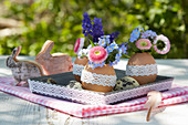 Posies in blown eggs with lace trim decorating Easter table