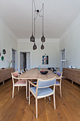 Simple timeless wooden furniture in dining room with three door