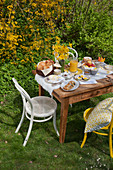Table set for Easter breakfast in garden