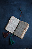Open vintage notebook with hand-made tassels as bookmarks