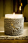 Votive candle lantern with knitted cover